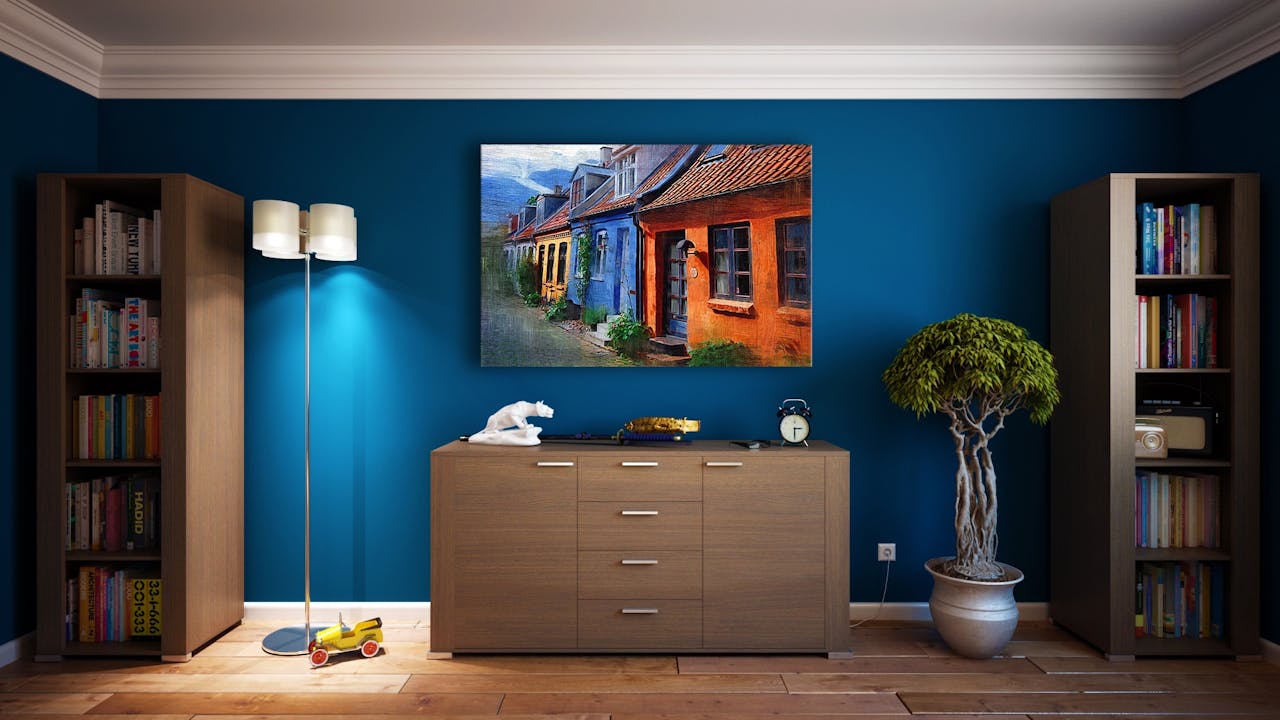 why-choose-us-01 A modern living room featuring stylish bookshelves, a vibrant painting, and minimalistic decor.